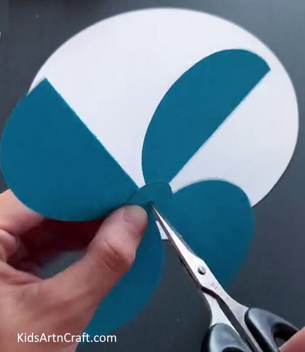 Making a Hole - Detailed Directions for forming a Summertime Paper Fan for Toddlers