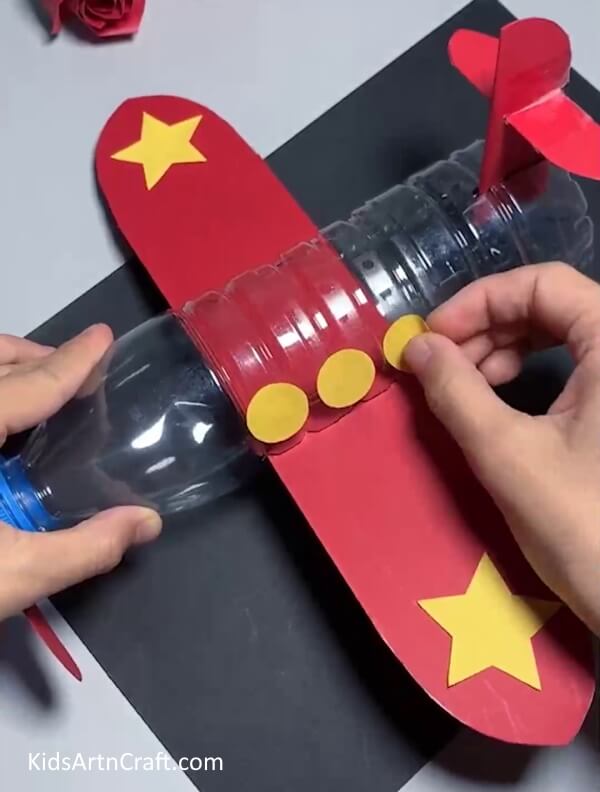 Pasting Circles - . Learn How to Construct an Aircraft Using Reused Water Bottles and Detailed Guidance 