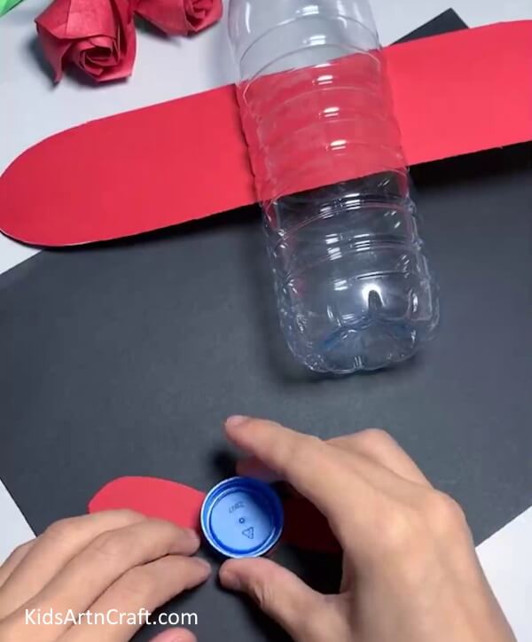 Pasting Fan On Bottle Cap - Step-By-Step Guide To Constructing An Airplane From Reused Water Jugs