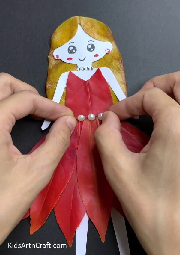 Adding Details - An endearing Autumn Leaf Doll Art & Handicraft Plan For Infants