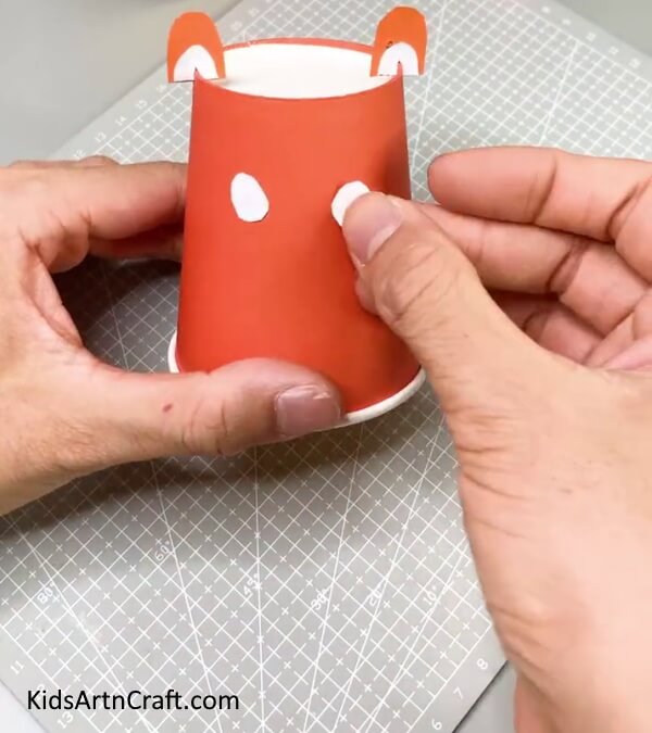 Pasting The Eyes Of The Tiger - Enchanting Tiger Paper Cup Craft For Kiddos 