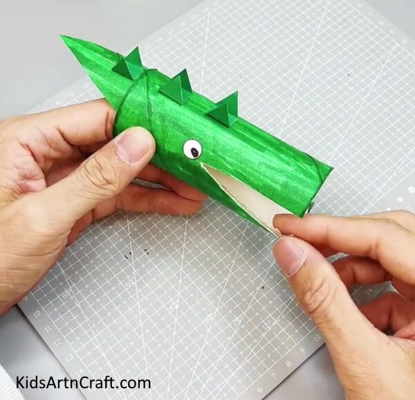 Pasting Eyes And Teeth Of Alligator - DIY Toilet Paper Roll Alligator Animal