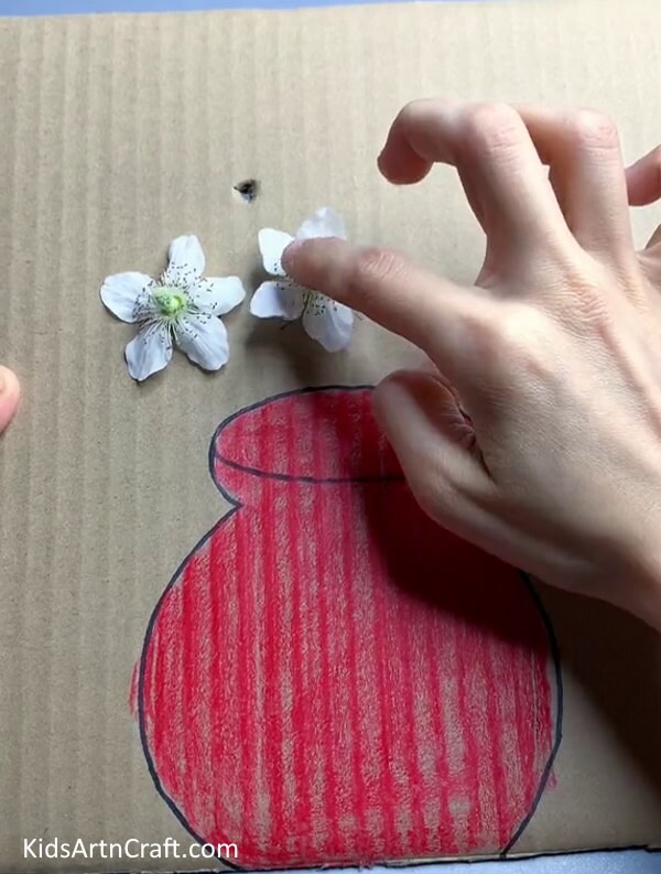 Attaching Flowers In Holes - Forming flower art with cardboard