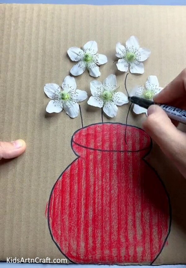 Drawing Stems Using A Black Marker - Creating a flower piece of art using cardboard