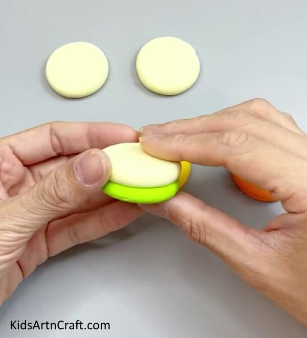 Stacking The Light Yellow Circle On Green Circle - Make Your Own Miniature Clay Cake Fun for Kids
