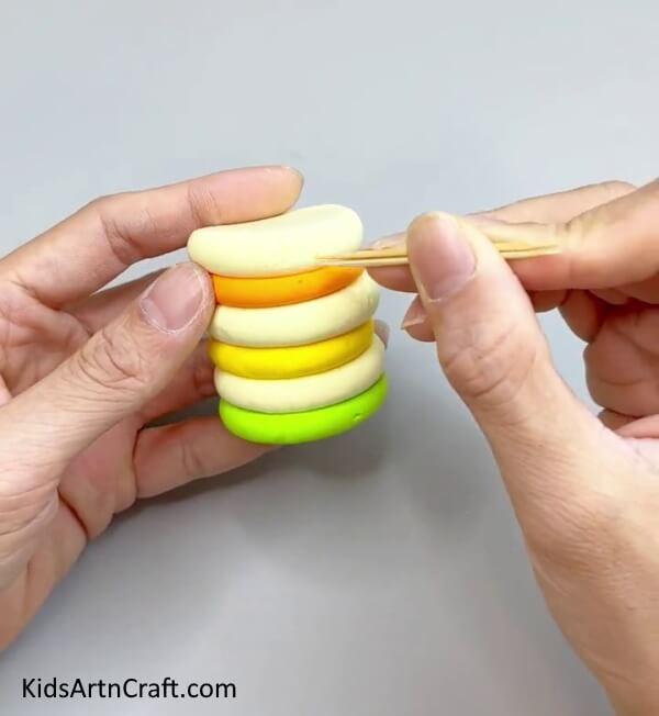 Pricking The Clay Circles With Toothpick - Creating Home-made Miniature Clay Cakes with Children