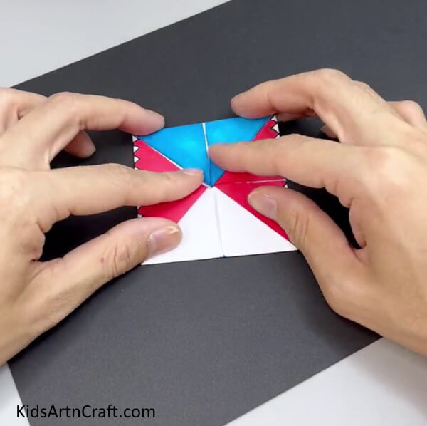 Flipping The Paper And Folding The Corners To The Middle - Guide to making a paper shark with origami steps