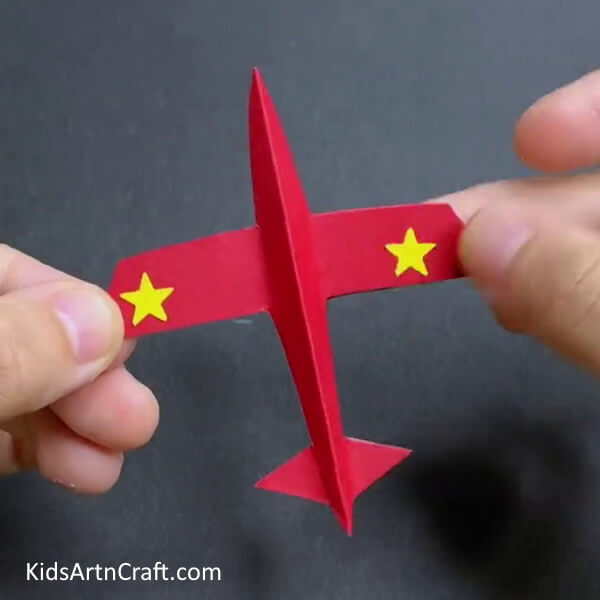 Adding Stars To The Airplane - Make a paper airplane with this easy DIY tutorial made just for kids. 