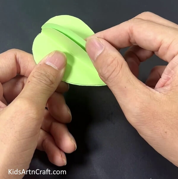 Pasting Green Paper Together - Paper cactus craft for children.