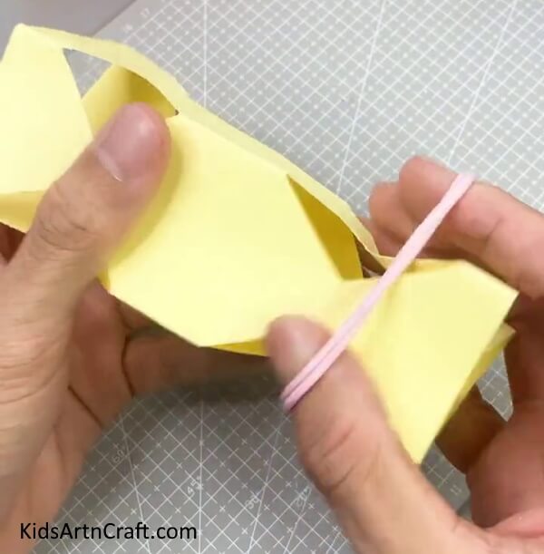 Applying Elastic Band - Develop A Captivating Paper Confectionery Creation For Children