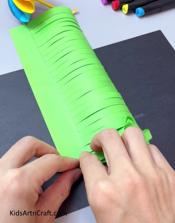 Folding The Green Strips - Designing a Paper Flower-- Perfect for Kindergarteners