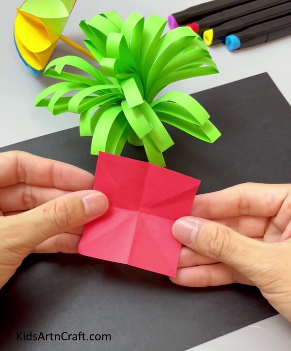 Creasing The Square Paper - Crafting a Paper Flower-- Kindergartners Can Easily Do It!