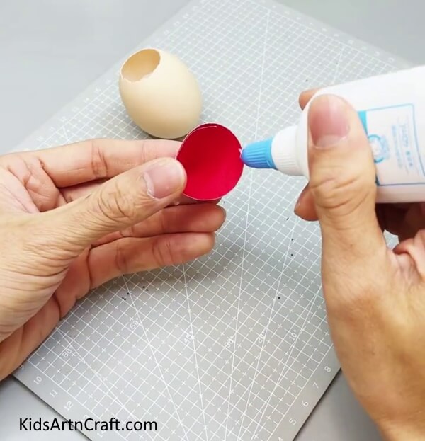 Applying Glue - Get Crafty this Christmas and Make an Eggshell Elf with the Kids.