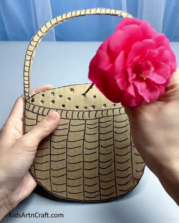 Inserting Flower Through The Hole - Tutorials on Building a Flower Basket with Youngsters
