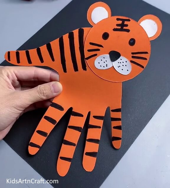 This Is The Final Look Of Our Paper Handprint Tiger Craft!- An awesome Handprint Tiger craft for kids.
