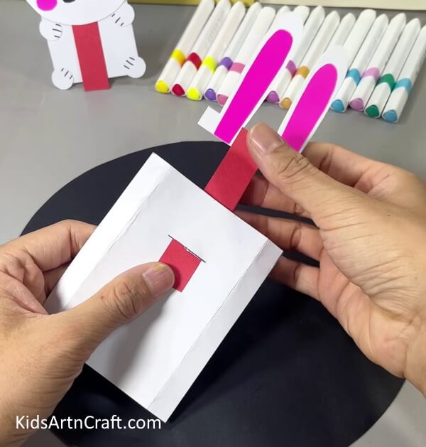 Inserting Red Paper Rectangle In Cut - Crafting a Bunny using homemade paper is a fun activity for kids. 