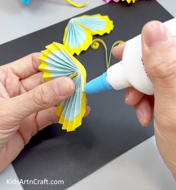 Applying Glue - Form a Butterfly Using Paper - A Manageable Assignment for Youngsters