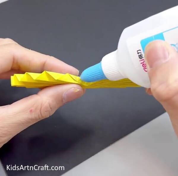Applying Glue On the Middle - Assemble a Paper Butterfly - An Uncomplicated Project for Kids