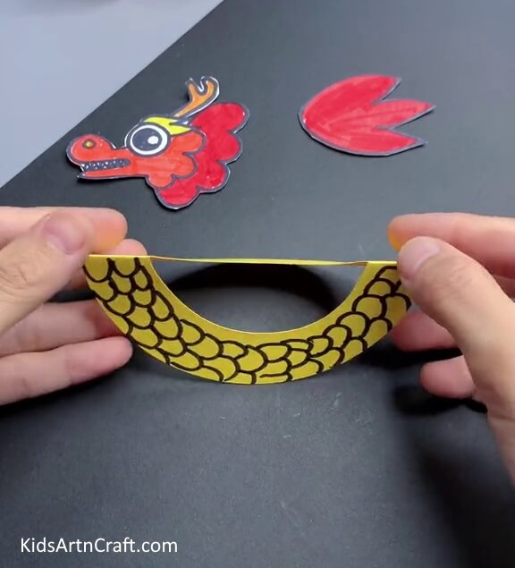 Unfolding The Body Form a paper Chinese dragon with the help of kids