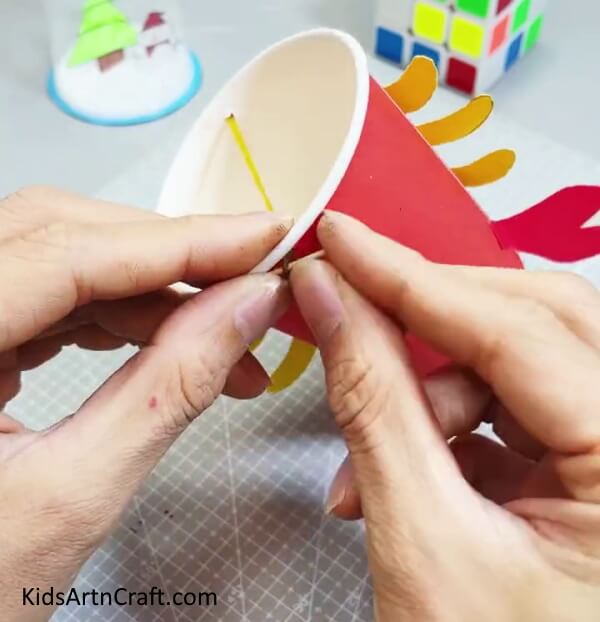 Securing The Rubber Band With A Stick - How to Create a Reusable Paper Cup Crab Craft With Clear Guidelines