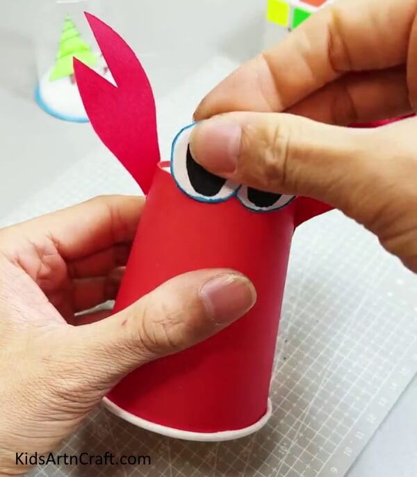 Pasting The Eyes - Tutorial For Making a Reused Paper Cup Crab
