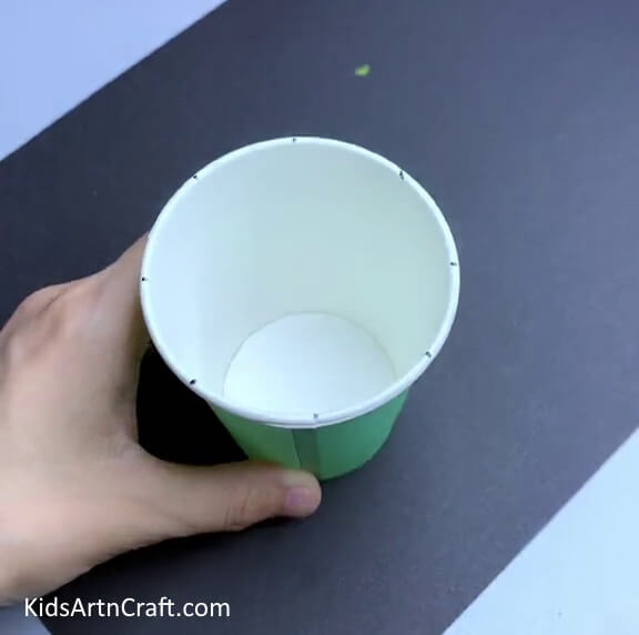 Completing The Marks - Ways to make a paper cup fan with kids, with helpful guides. 