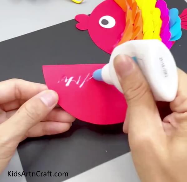 Pasting the Semi Circle - How to make a Fish out of Paper with a straightforward guide for children