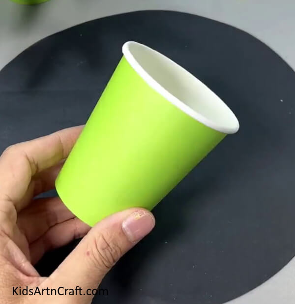 Getting Ready With A Green Paper Cup - Step-by-Step Directions for Making a Paper Flower Hanging