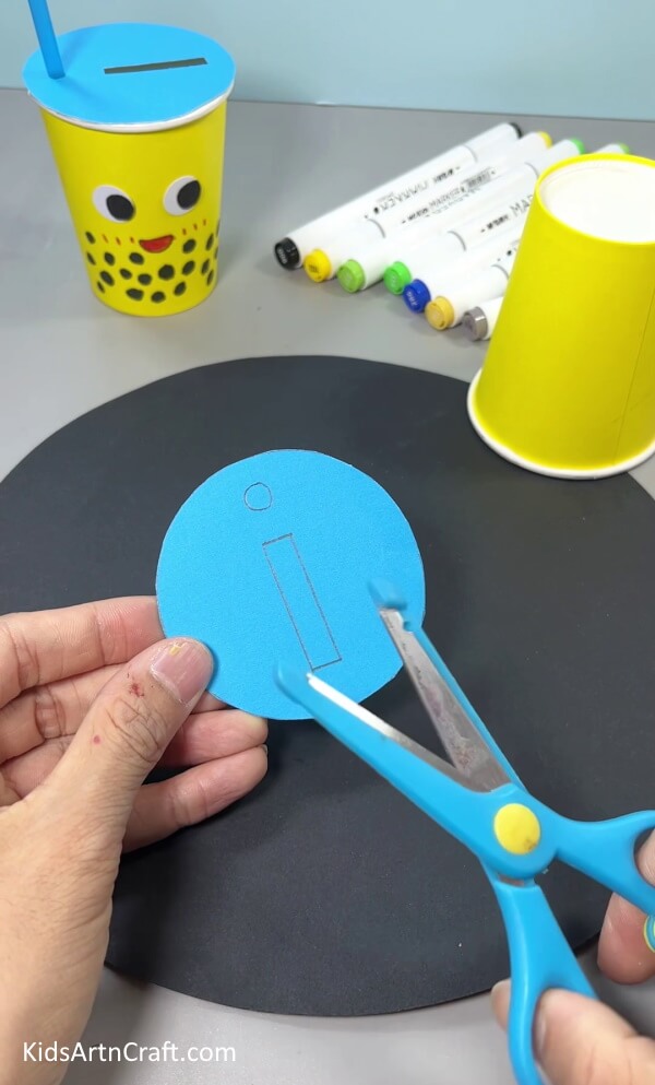 Cutting A Rectangle and Circle From Circle - Put together your own recycling craft with this straightforward activity.