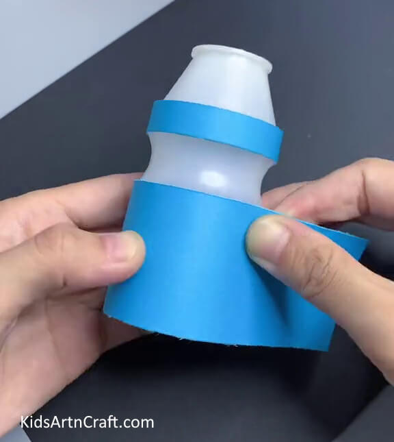 Wrapping A Blue Rectangle - Create a Doll Out of a Plastic Bottle and Recycled Pieces 
