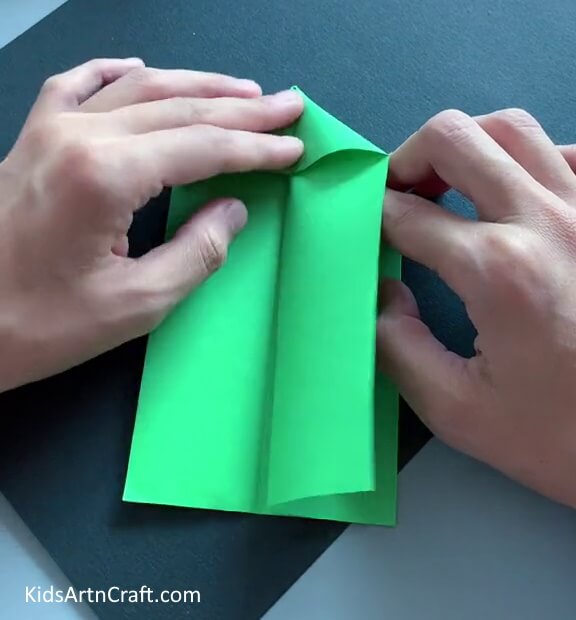 Pushing the Corners of the Paper Inside - An enjoyable exercise for kids to make a paper toy craft.