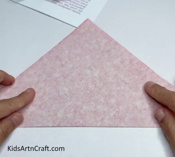 Folding Square Paper To Form Triangle - Construct a Straightforward Snowflake Craft for Children