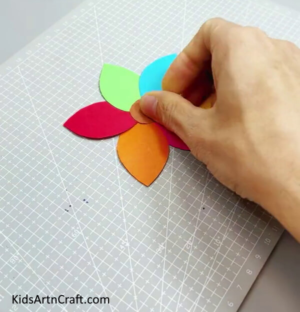 Pasting Another Circle - Kids can have fun constructing a basic and colorful paper flower. 
