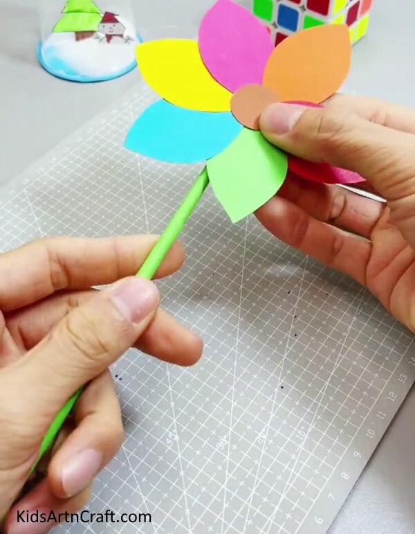 Pasting The Stem - Making a simple and bright paper flower is a great activity for children. 