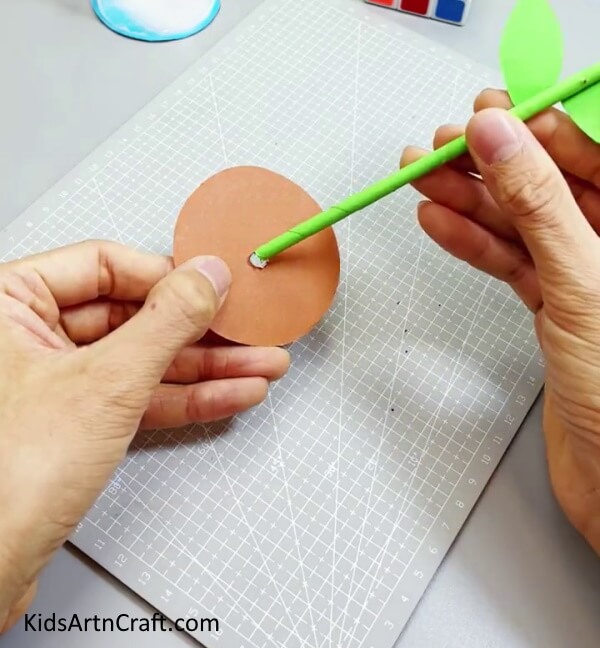Putting The Stem Inside The Hole - An uncomplicated and attractive paper flower is a great craft for children. 