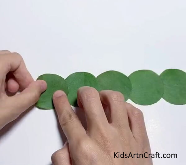 Pasting Leaf Circles To Make Caterpillar's Body - Make a Caterpillar with Colorful Leaves
