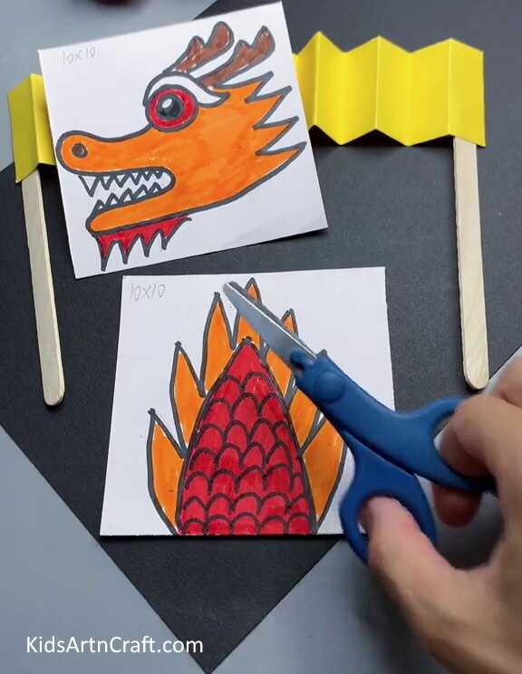 Cutting Out Dragon - Learn how to make a Chinese Paper Dragon with ease for young ones.
