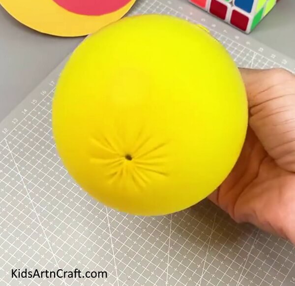 Making Design At the Bottom Of the Balloon - An Inventive Balloon Emoji Design For Kids To Participate In 