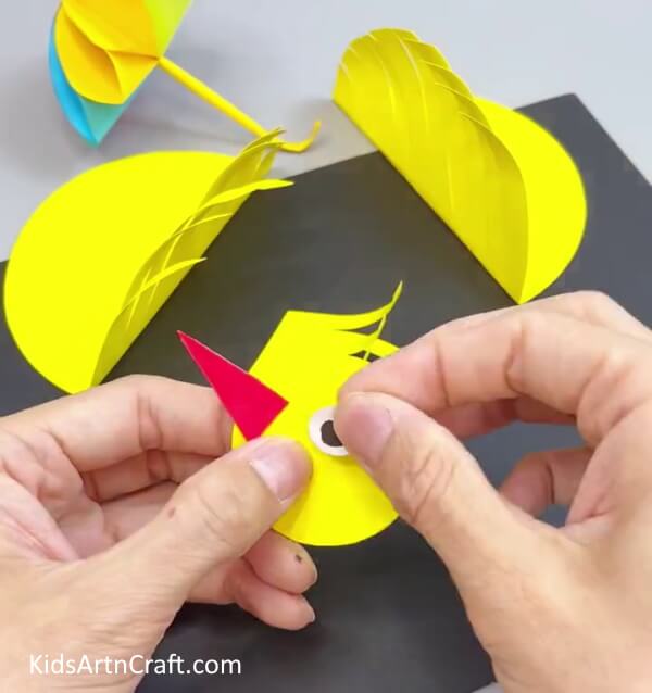 Pasting Another Eye - Appealing Paper Bird Craft For Children To Play With