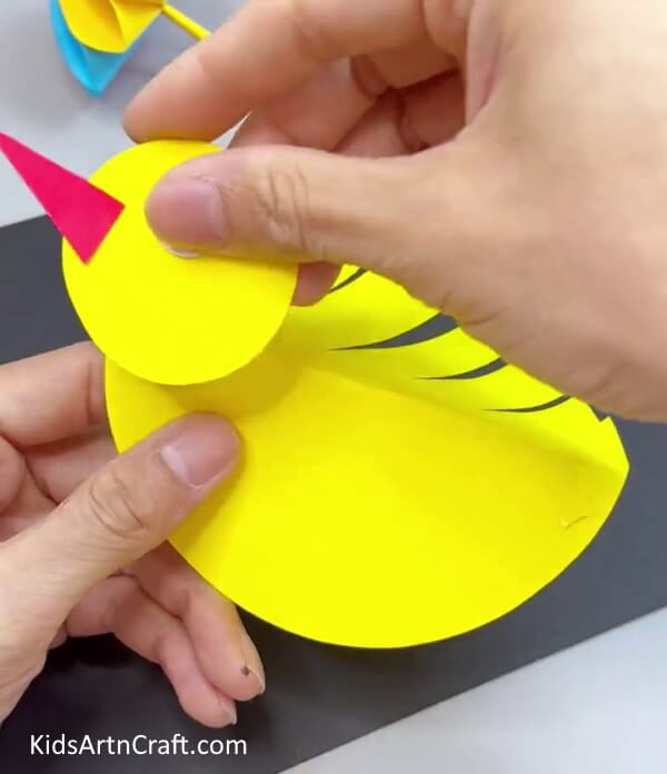 Pasting Face On Body - Endearing Paper Bird Toy For Kids To Have Fun With