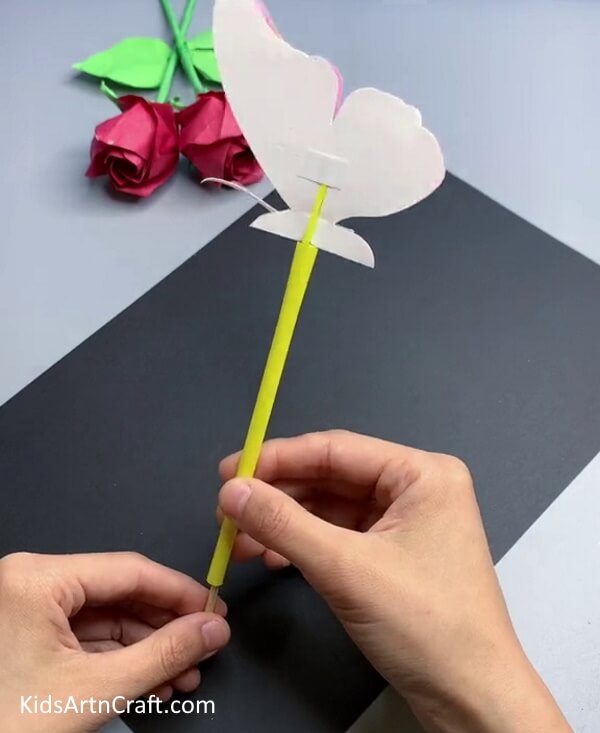 Removing The Wooden Stick - An Endearing Paper Butterfly Craft Project For Children To Assemble 