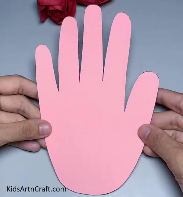 Cutting Handprint Out of Pink Paper - Crafting Handprint Rabbits out of Paper