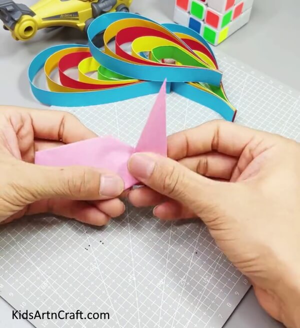 Folding the End Of the Paper to its 90 Degrees - Peacock Craft Tutorial Made From Simple Paper Strips for Youngsters 
