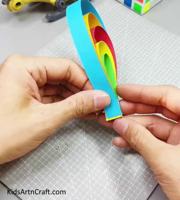 Pasting The Other Strips and Making the Tail Off the Peacock - A Simple Paper Strip Peacock Craft Tutorial for Young Children