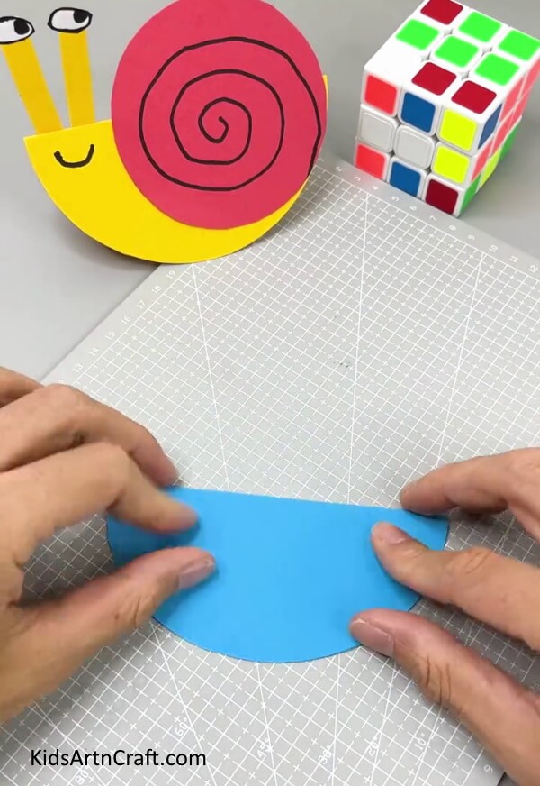 Folding Circle In Half - A fun paper craft for children that requires minimal effort.