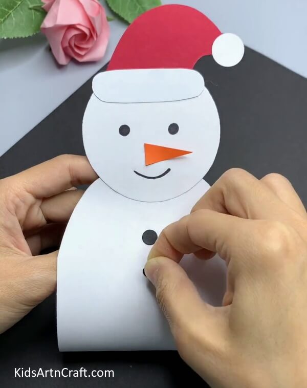 Pasting Buttons - A basic snowman paper craft idea for Kindergarten students.
