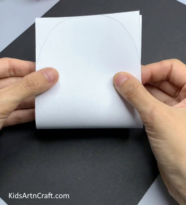 Folding Paper In Half - A basic snowman paper craft project for Kindergarteners.