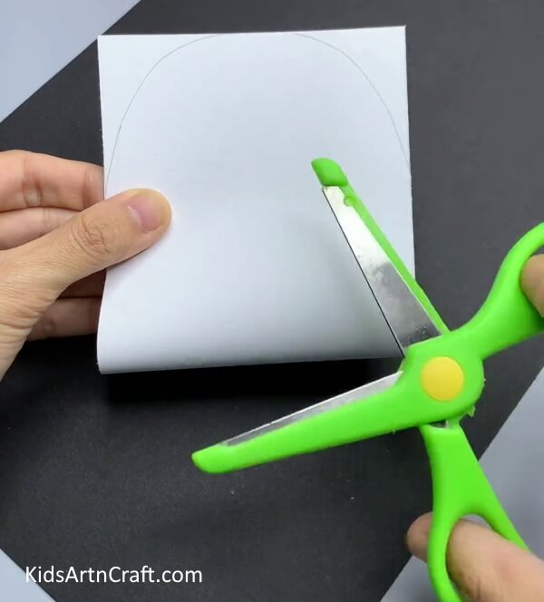 Cutting Curve Shape On Top - A simple snowman paper craft idea for Kindergarten children.