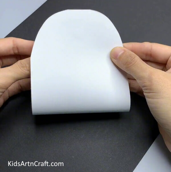Gluing Top Edges - A creative snowman paper craft for Kindergartners.