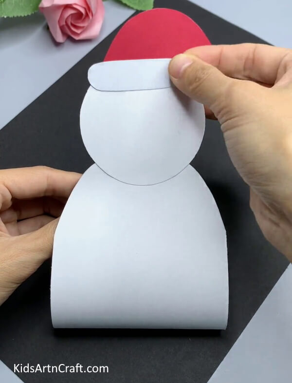 Pasting A White Strip  - A fun snowman paper craft activity for Kindergarteners.
